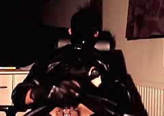 Breathplay masturbating pierced cock in black leather coat