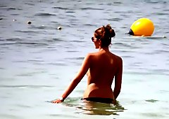 Hot body brunette with perfect tits on beach