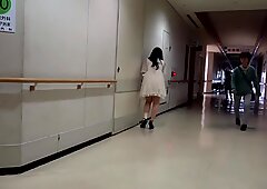 Japanese girl unwraps bandage from her injured ankle